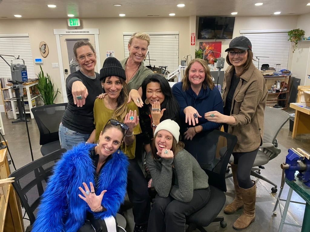 Group of women posing together in an Jewelry studio